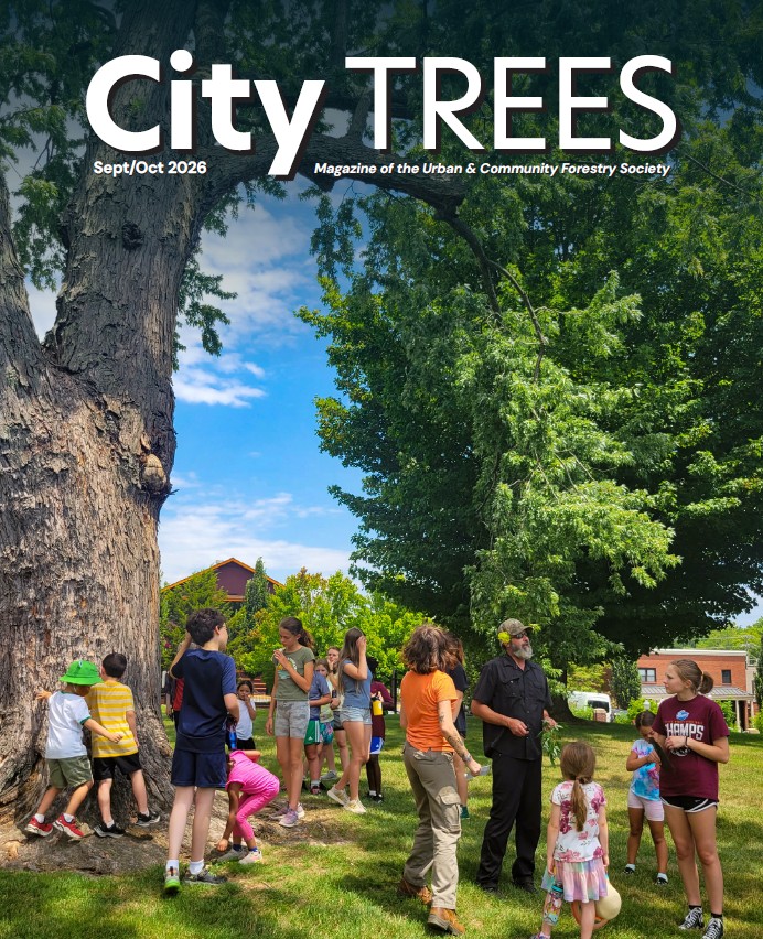 Cover of City TREES magazine showing a group of children and adults socializing in a park beside a large tree; Sept/Oct 2026